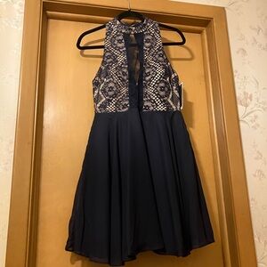 Short formal dress with sheer top and full skirt